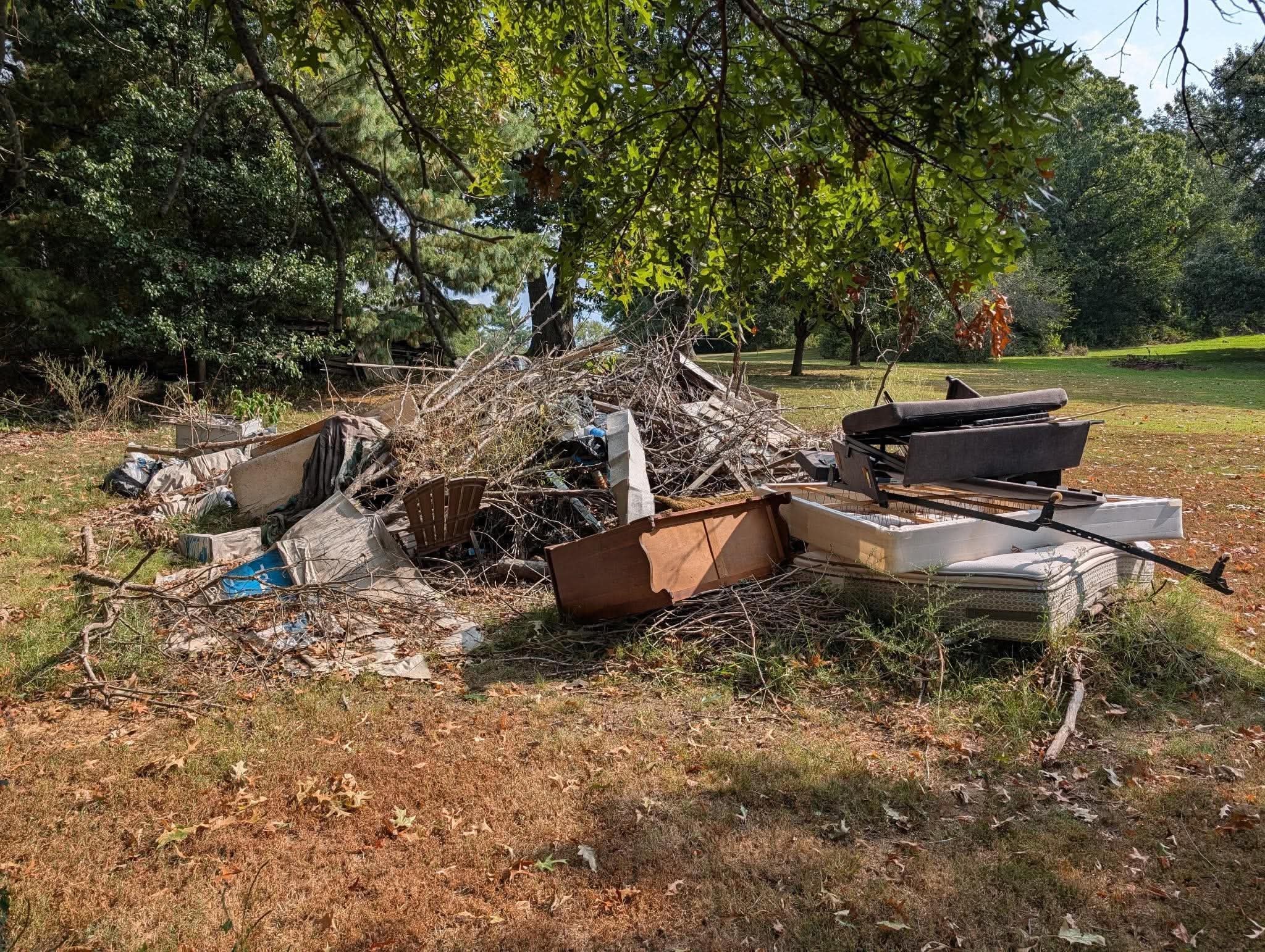 Large pile of mixed debris and old furniture cleared from a property